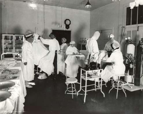 p Col. William L. Keller, Chief of Surgery, at work.