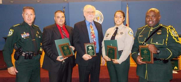 Second Quarter Awards Left to right: Detective Nicholis Whiteman, Juvenile Programs Supervisor Sherwood Woody Hanford, Explorer Kayle Perez and