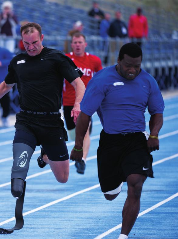 Army team member Robert Brown (center, wearing black) sprints toward the finish line in a Warrior Games race.