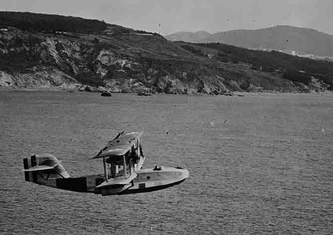 Lt. Braxton Rhodes demonstrated the feasibility of using flush-deck catapults to launch landplanes when they catapulted in a DT-2 torpedo bomber from Langley (CV 1) while the carrier lay moored at