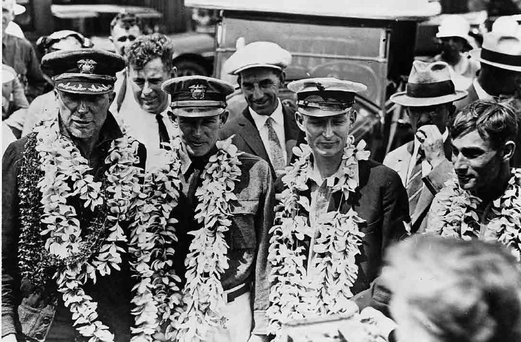 1925 continued 184669 Cmdr. John Rodgers and his crew receive a traditional Hawaiian greeting at Kauai after their harrowing crossing. Territory of Hawaii.