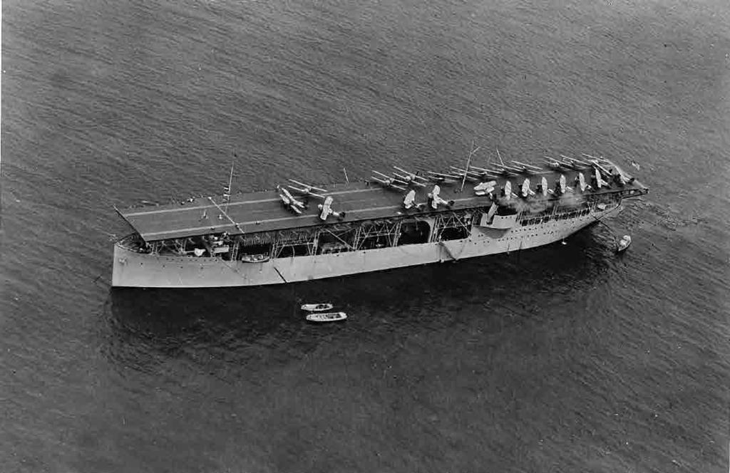 1922 continued Fighters and torpedo planes pack the deck of the first U.S. aircraft carrier, Langley (CV 1).