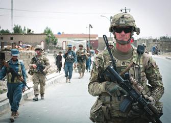 SSG James Allen, Company B, 3rd Battalion, 66th Armor Regiment, conducts a dismounted patrol alongside his platoon s Afghan uniformed police partners in Paktika Province, Afghanistan.