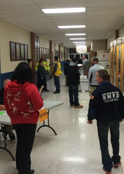 Top Left: A mock evacuation site is in full swing in the halls of Montoursville Area High School. Lower Left: Tommie L.