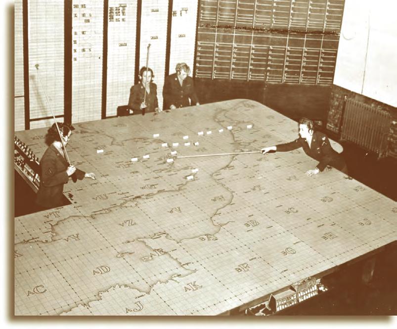 USAAF personnel are shown here plotting an 8th Air Force bombing mission.