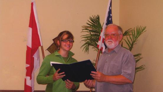 In photo Nichole receives the award from President Jack Parker.
