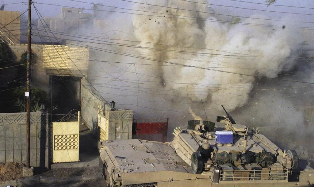 P a t t e e Marine M1A1 Abrams returning fire in Fallujah, during Operation Al Fajr 1 st Marine Division Combat Camera (James J.
