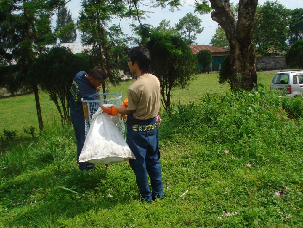 Picture 6: Volunteers emptying waste bins installed by the institute