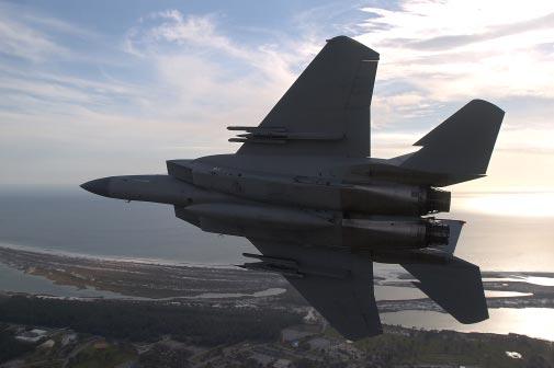 Above, an F-15D that collects telemetry data returns from a live weapons-fire exercise.