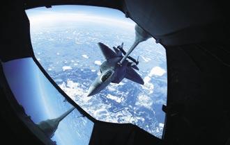USAF photo by A1C Jonathan Snyder A KC-10 Extender gasses up an F-22 26,000 feet above Eielson during Red Flag- Alaska.