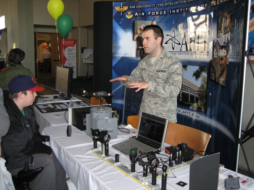 (a) (b) Figure 2: The LPD as part of the AFIT Booth at TechFest in Dayton, Ohio (March