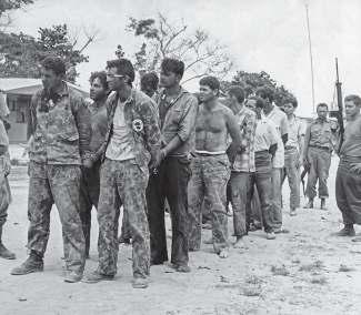 Brigade members being rounded up as prisoners of war after the battle.