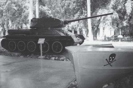 Relics from the Bay of Pigs battle exhibited at the Museum of the Revolution in Havana: a T-34/85 tank, and one of the Brigade s small landing boats.