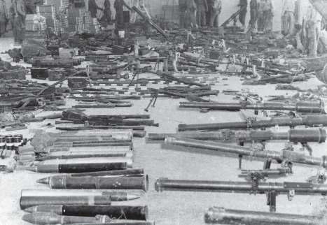 58 Some of the Brigade s arsenal of weapons and ordnance, captured after the battle, is placed on display.