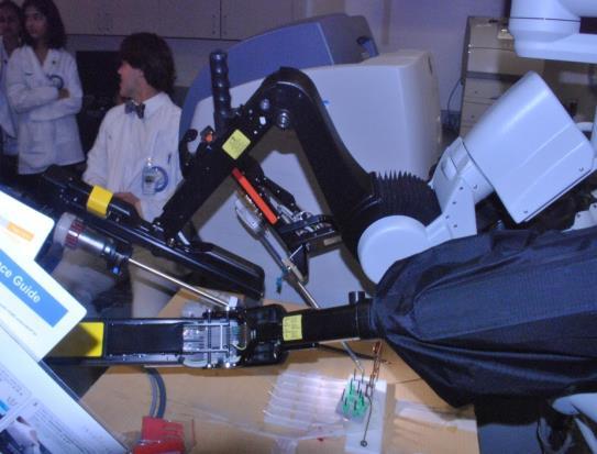 for patients. Everyone had an opportunity to practice tying sutures and move objects with the robotic arms. After seeing what it takes to control the robot, the students watched a live operation.