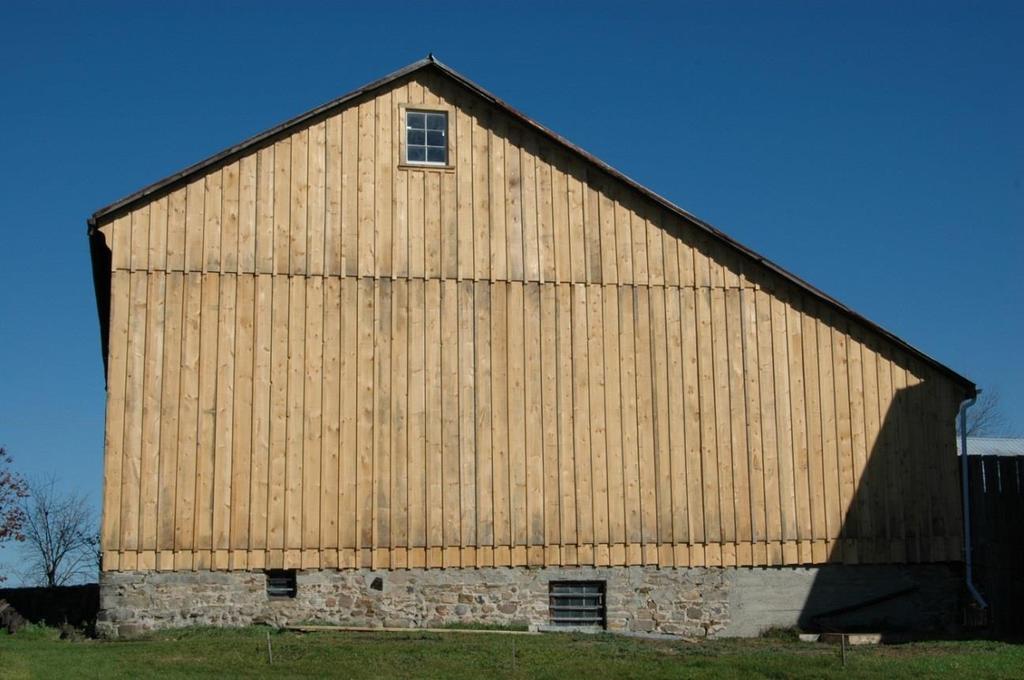 brickwork, restored windows. Alexander Smith Farmstead: Resided barn.