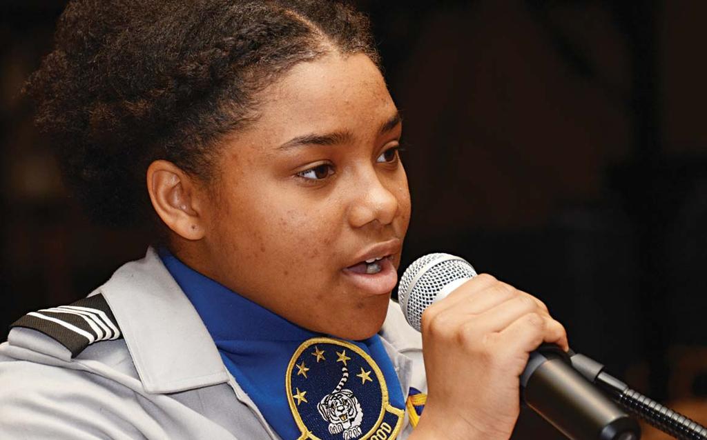 NEWS Photo by ROBERT TIMMONS Destiny Woodall, a member of the Blythewood High School Junior ROTC female drill team, sings Rise Up during the Fort Jackson Women s History Month luncheon March 18 at