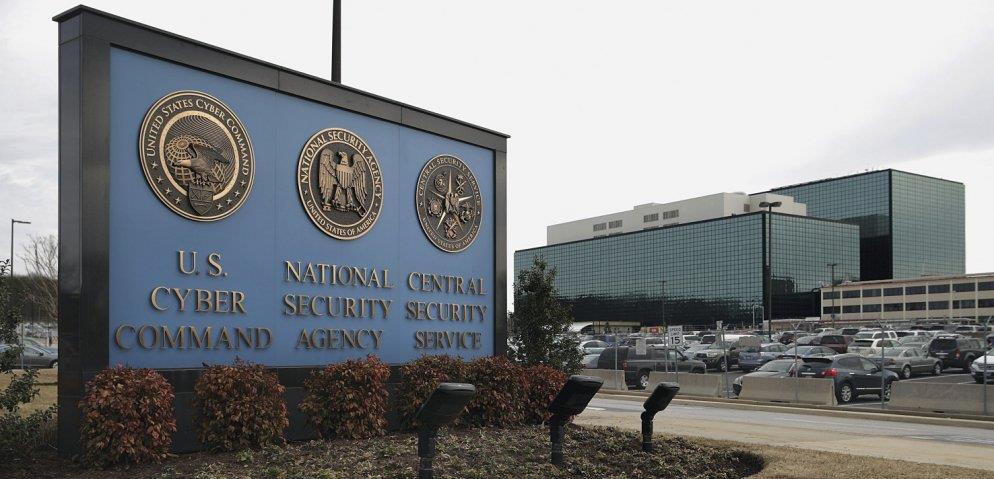 The seals of USCYBERCOM, the NSA, and the Central Security Service greet employees and visitors at the campus that the three organisations share, 13 March 2015, Fort Meade, Maryland.