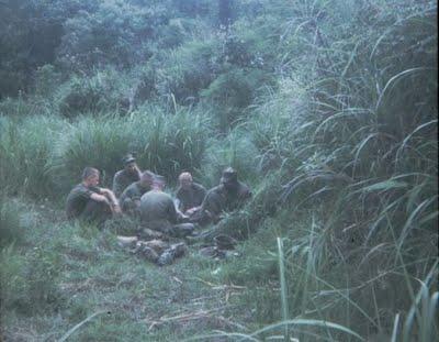 He further indicated that he had received reports of numerous NVA troops on the hill. CPT Coulter briefing LT Anthony, SSGT Burton and others.
