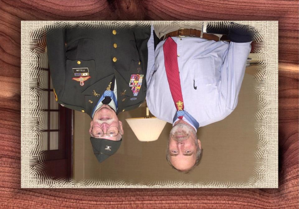 Colonel Lew Millett (USA-Korea) and Retired Army Major Drew Dix (USA, Special Forces-Vietnam) share a moment of camaraderie and mutual respect during the annual Medal of Honor convention.