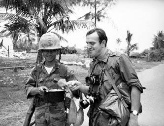 AP photo Peter Arnett of the Associated Press (with cameras) produced controversial reports on two major events. Walter Cronkite (right) told his TV audience that the US was mired in stalemate.