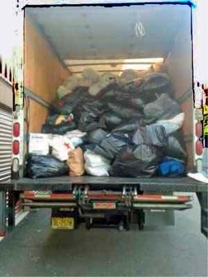 Shown here is a tractor trailer at e Cherry Hill West Interact Club filled wi 2,000 pounds of cloes.
