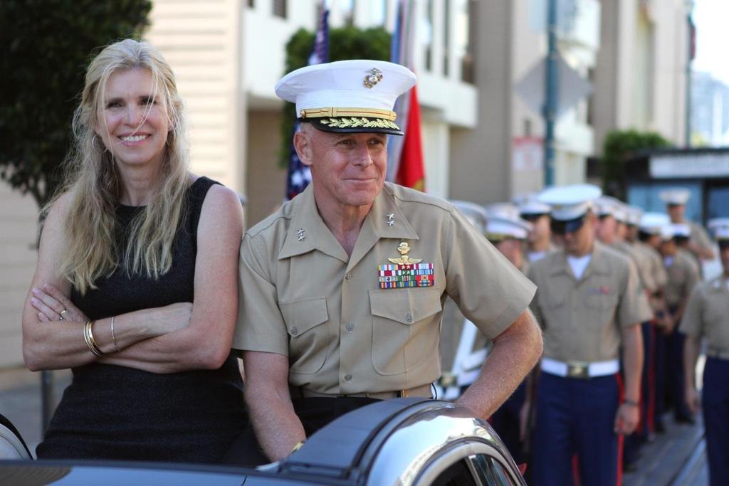 Major General Melvin Spiese, commanding general of 1st Marine Expeditionary Brigade, and his wife, Filomena, ride alongside Marines during the 144th Annual Italian Heritage Parade in downtown San