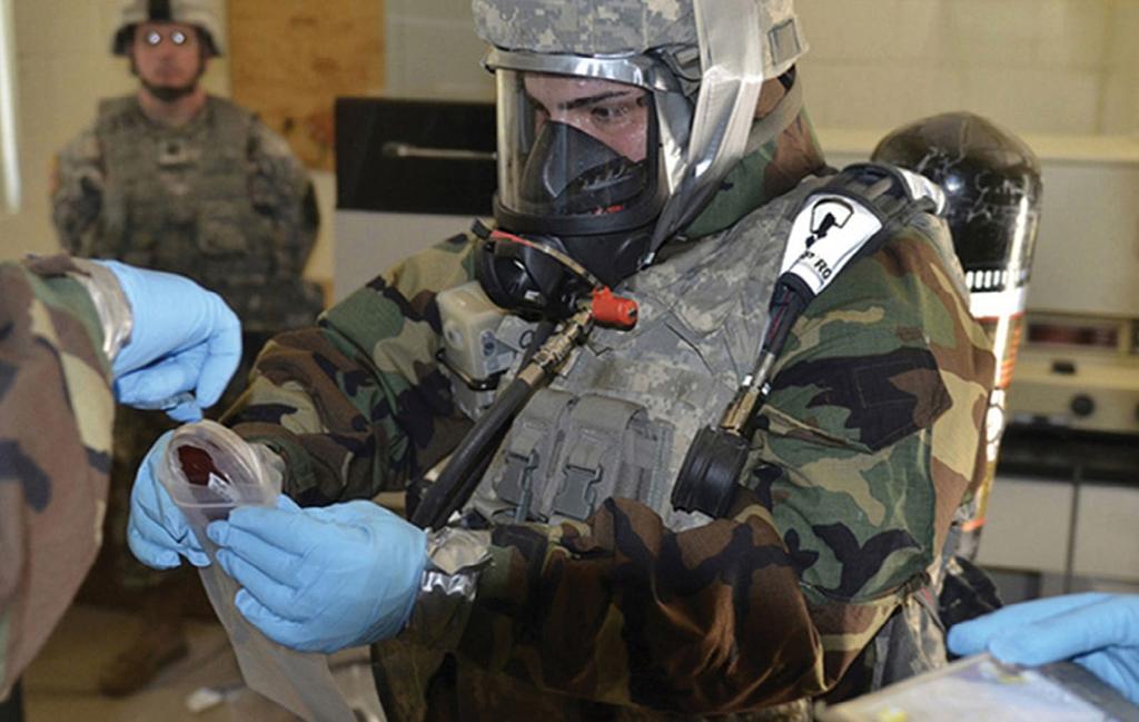 COUNTERING WMD A soldier from the 23rd Chemical, Biological, Radiological, Nuclear Battalion trains on weapons of mass destruction site exploitation skills during a field training