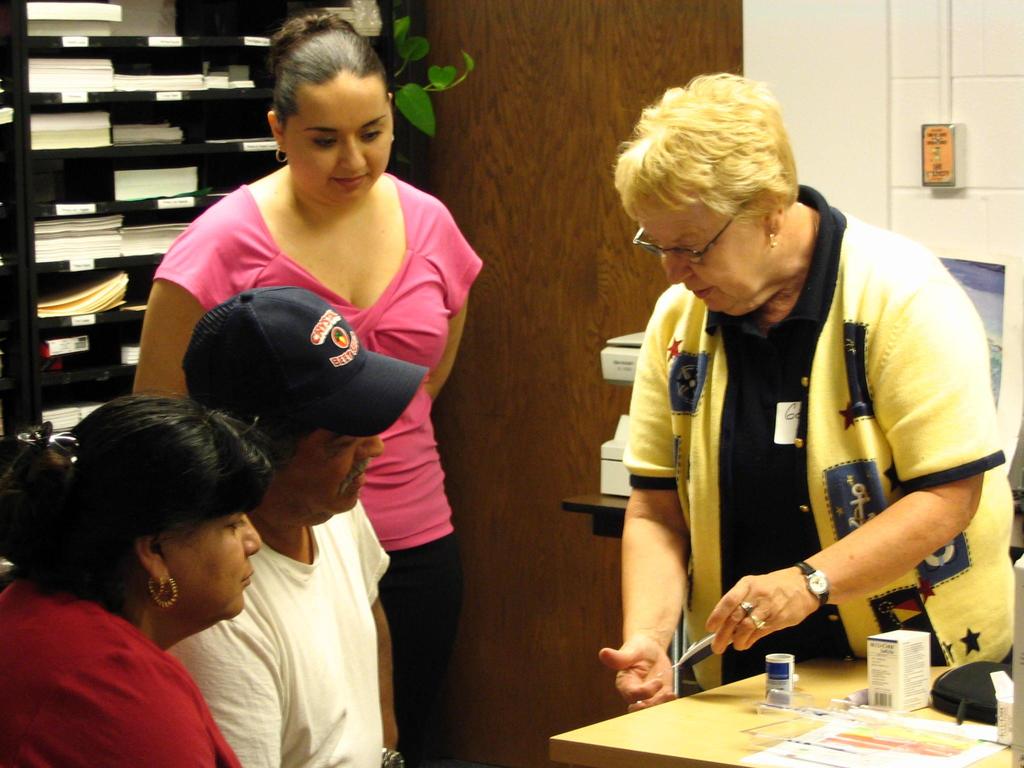 A diabetes educator providing instructions to patients on how