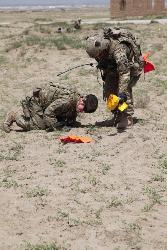 Explosive Ordnance Disposal technicians dispose of the