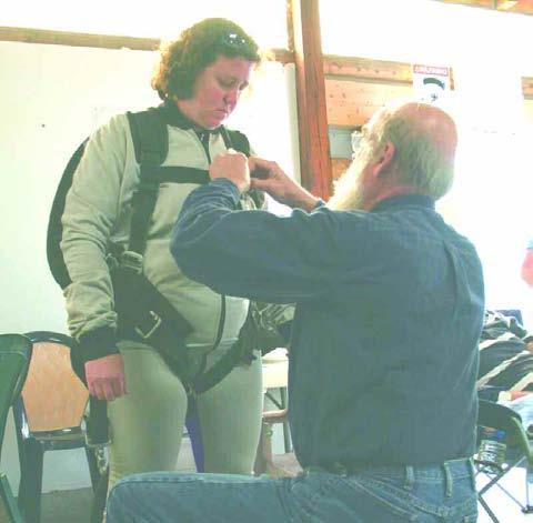 The Sunday Independent Sunday, June 8, 2008 Page 5 SUITING UP Amy Wood s tandem parachute jump partner Larry helps her suit up before her jump out of an airplane at 15,000 feet.