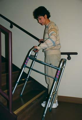 Stairs Using Walker 1. Hold onto rail at bottom of stairs.