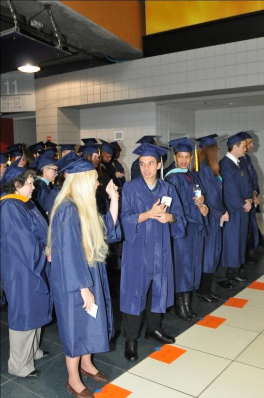 AFTER REGISTRATION Graduates are organized in 5 rows by height (see
