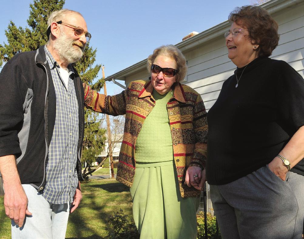 Jerry Walter Foster (left to right) of Silver Spring, Md., gets a visit from Elizabeth O Connor and Carol Smith of neighboring Saint Andrew Apostolic Catholic Church.