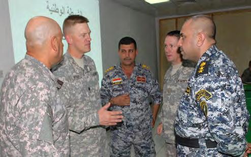 Lt. Col. Darren Werner, commander, 4th Support Battalion, 1st Brigade Combat Team, 4th Infantry Division, Multi-National Division - Baghdad, meets with Iraqi National Police Col.