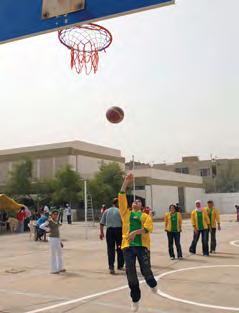 Iraqi high school for girls adds new sports facilities A young Iraqi girl practices her basketball shot while her team watches from behind her July 16 in the Rashid district of southern Baghdad.