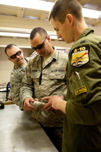 1st Lt. Mike Binford, 190th Fighter Wing "Warthog" pilot from Boise, Idaho, inspected a M-905 fuse for a MK 82 low-drag bomb with help from Senior Master Sgt.