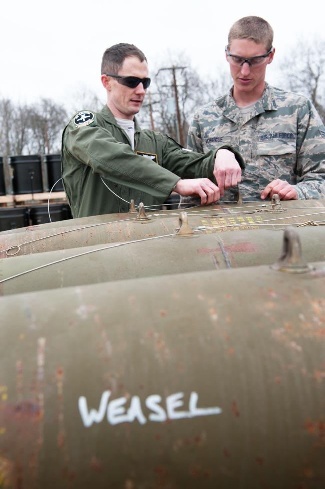 MAY 3, 2014 A DAY IN THE LIFE OF BINFORD S BOMB Senior Airman Shad McHargue, right, 124th Maintenance Squadron, munitions systems specialist, assisted 1st Lt.