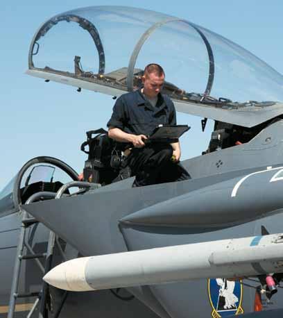 1 2 3 1 A1C Richard Dougherty inspects an F-15E after the day s flight activity.