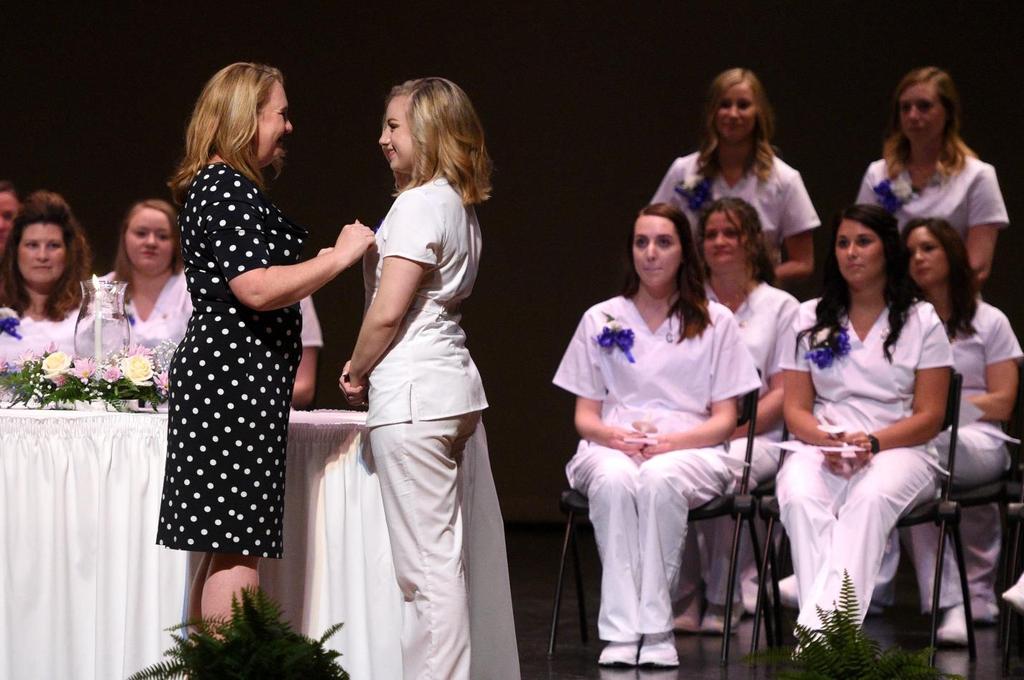 An engaging night for BC3 registered nursing graduates Pinning ceremony rings in new eras, marriage proposals May 11, 2018 Julia Carney, left, a Butler County Community College faculty member, places