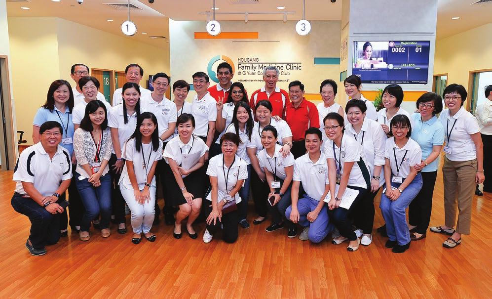 02 FEATURE Staff and Senior Management taking a picture with PM Lee.