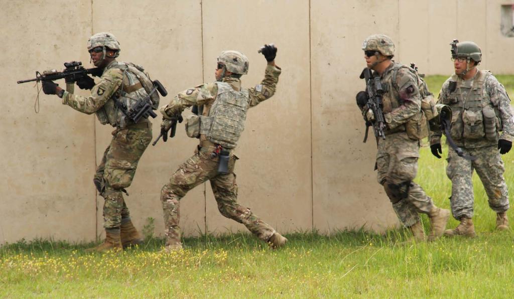 Soldiers with the 1st Battalion, 327th Infantry Regiment, 1st Brigade Combat Team, 101st Airborne Division (Air Assault) prepare to breach a building during a battalion live fire at the Peason Ridge