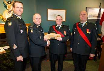 CO, LCol Weidlich; RSM Reinelt; and CWO Rutherford present MCpl Vallar with the Top Musician s Award.