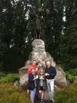 Bettyanne (front left) with family at one of the five Caribou Trail markers. Belgium.