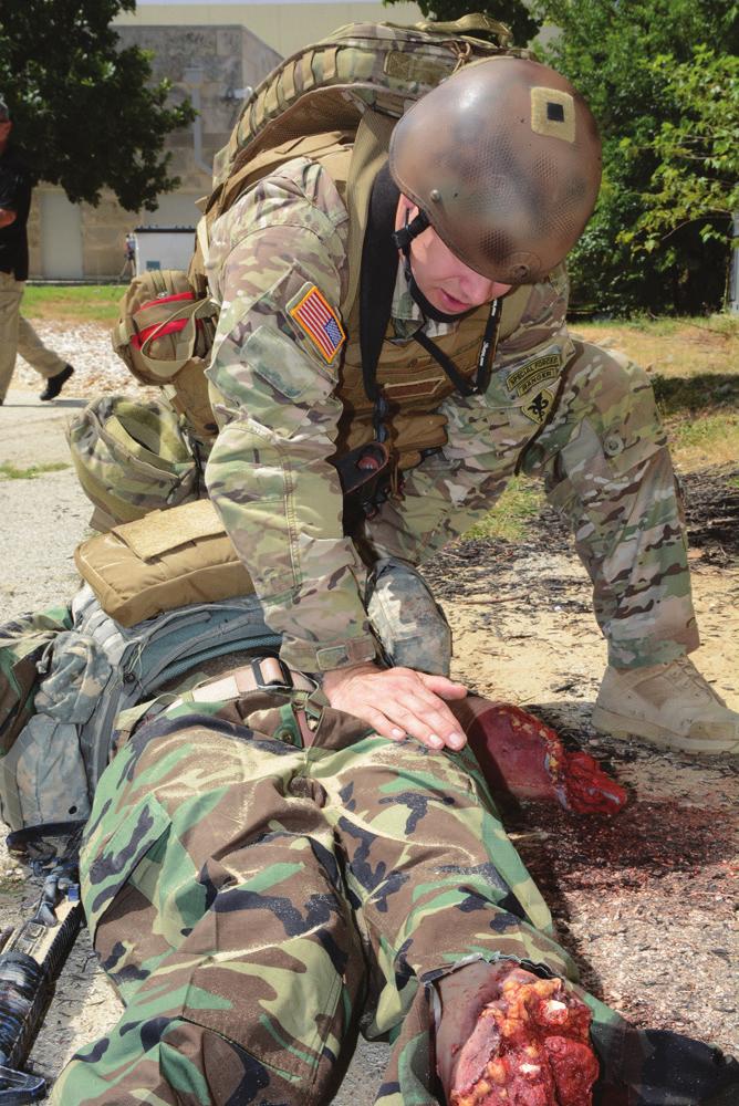 US Army Physician Assistant Handbook Figure 21-1. A student training during the care under fire phase of tactical combat casualty care. Photo by Jose E.