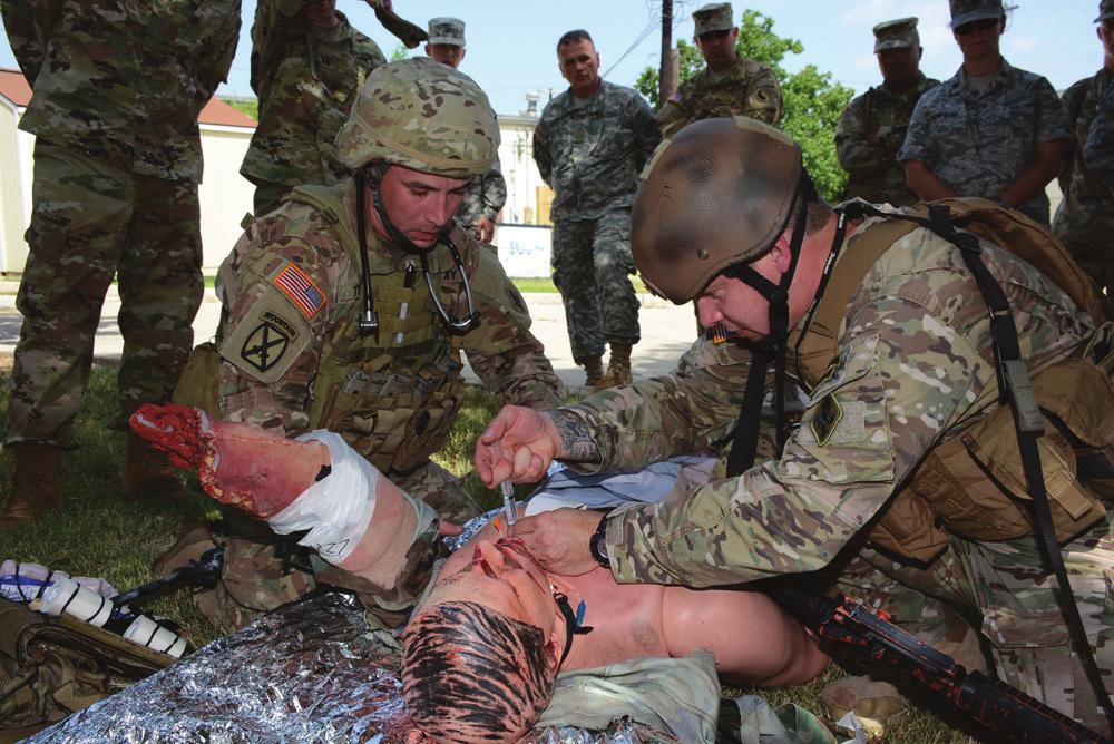 US Army Physician Assistant Handbook Figure 21-2. Students treating hemorrhage using the principles from tactical combat casualty care. Photo by Jose E.