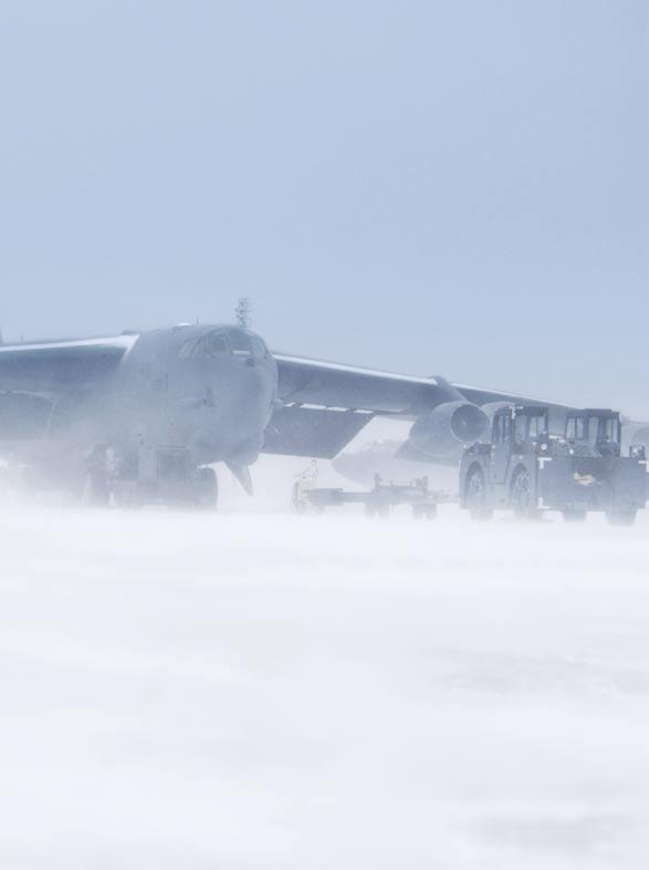 A B-52 Stratofortress is prepped for flight on the frigid flight line at Minot AFB, N.D. Force Revival By Michael C.