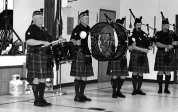 Members and employees of NLI This year s meeting included entertainment by the the Sandpoint High School Performing Choir, top, who harmonized the National Anthem, and the Albeni Falls Pipes and Drum