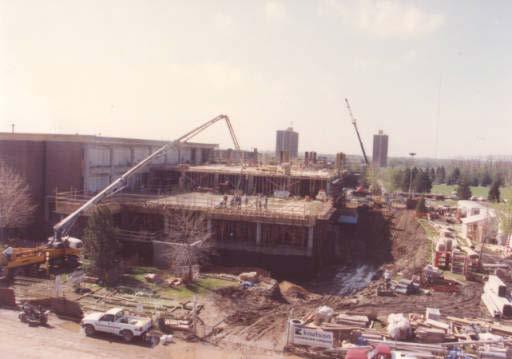 Building our Digital Future A photograph of the construction on Memorial Library addition; Unidentified workers on building; Mankato State University, 1991.