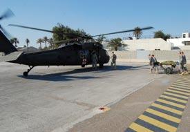 Aviaion Brigade, 4h Infanry Division, flies side-by-side wih a UH-1 Huey from he Iraqi Air Force s 2nd